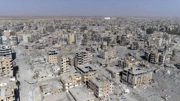 A drone grab reveals mile after mile of damaged buildings, rubble-filled streets and destroyed landmarks in Raqqa, Syria two days after Syrian Democratic Forces said military operations to oust the Islamic State have ended. A long road lies ahead before citizens can return to cities they once called home and remnants of ISIS rule are widespread amid the carnage in the meanwhile. (Gabriel Chaim / AP)