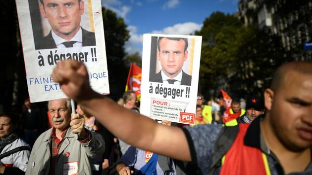 Protestors shout slogans as they march carrying placards during a demonstration called by the General Confederation of Labour (CGT), a French worker's union, as part of nationwide rallies against the French president's labour law reforms in Paris. (Lionel Bonaventure / AFP)