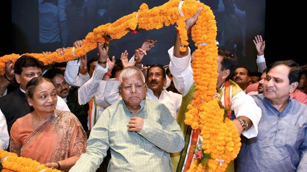 RJD chief Lalu Prasad with Congress leader Meira Kumar being garland by party workers during the 130th birth anniversary of Bihar Kesari Shri Krishna Singh in Patna on Saturday. (PTI Photo) RJD chief Lalu Prasad with Congress leader Meira Kumar being garland by party workers during the 130th birth anniversary of Bihar Kesari Shri Krishna Singh in Patna on Saturday. (PTI Photo)