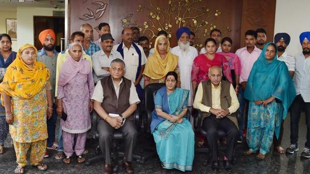 External affairs minister Sushma Swaraj, minister of state MJ Akbar and VK Singh with the families of 39 Indian men missing in Iraq since June 2014, in New Delhi in July.(PTI File Photo)