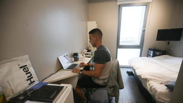 Adam Saez, a 26-year-old sports trainer who has lived in Old Oak for over a year, sees his rent as ‘an investment’. ‘I’ve not only made friends, but I’ve also done a lot of networking, so I’ve met lot of people that I now work with as well,’ he told AFP. (Daniel Leal-Olivas / AFP) Adam Saez, a 26-year-old sports trainer who has lived in Old Oak for over a year, sees his rent as ‘an investment’. ‘I’ve not only made friends, but I’ve also done a lot of networking, so I’ve met lot of people that I now work with as well,’ he told AFP. (Daniel Leal-Olivas / AFP)