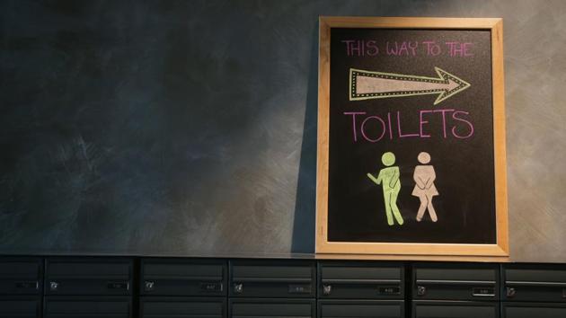 A toilet sign is seen on top of the post boxes at the co-living building. Some rooms in the building have a tiny ensuite bathroom with a small wash basin placed almost over the toilet. In others, the washroom areas are shared. (Daniel Leal-Olivas / AFP) A toilet sign is seen on top of the post boxes at the co-living building. Some rooms in the building have a tiny ensuite bathroom with a small wash basin placed almost over the toilet. In others, the washroom areas are shared. (Daniel Leal-Olivas / AFP)