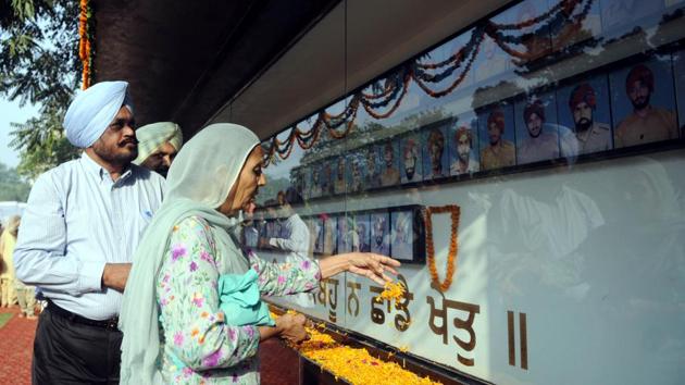 Families members of police personnel pay tributes to the police martyrs during a function on Police Commemoration Day at Police Line in Patiala on Saturday. (Bharat Bhushan /HT)