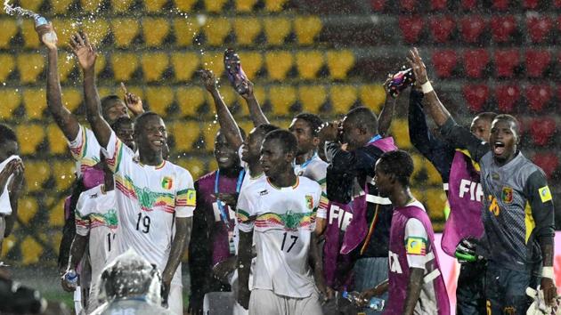 Mali football players celebrate after winning against Ghana at the FIFA U-17 World Cup quarterfinals. (AFP)