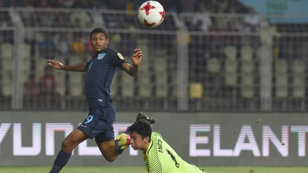 Rhian Brewster of England shoots past Justin Garces of USA to score the second goal. (AFP)