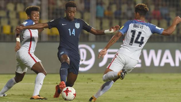 Chris Gloster (L) and Akil Watts of USA tackles Callum Hudson-Odoi of England. (AFP)