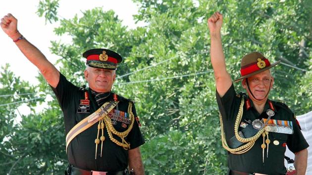 Army chief General Bipin Rawat on behalf of the President Ram Nath Kovind presents the 'President's Standard' to 47 Armoured Regiment at the Sunjawan Military Station, in Jammu on Saturday.(PTI Photo)
