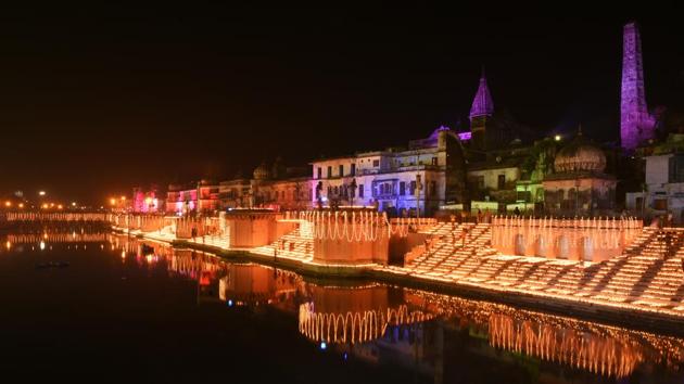 People light earthen lamps on the banks of river Saryu during Deepotsav in Ayodhya, Uttar Pradesh on Wednesday. The UP state tourism department in association with the Avadh University and the district administration aimed to set a new world record by lighting more than 171,000 earthen oil lamps on the steps of the Sarayu ghats at Ram Ki Paidi . (Deepak Gupta / HT Photo) People light earthen lamps on the banks of river Saryu during Deepotsav in Ayodhya, Uttar Pradesh on Wednesday. The UP state tourism department in association with the Avadh University and the district administration aimed to set a new world record by lighting more than 171,000 earthen oil lamps on the steps of the Sarayu ghats at Ram Ki Paidi . (Deepak Gupta / HT Photo)