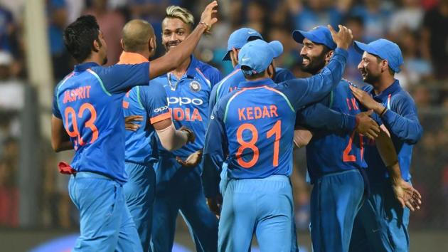 Indian cricket team players celebrate after the wicket of New Zealand batsman Martin Guptill. (AFP)