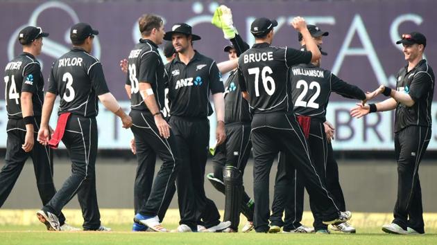 New Zealand players celebrate after taking the wicket of Dinesh Karthik. (AFP)