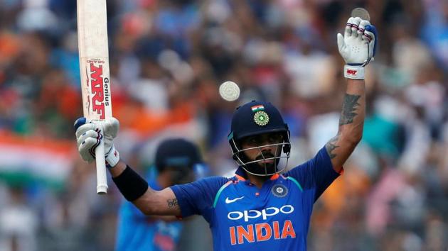 India captain Virat Kohli celebrates his century against New Zealand in Mumbai on Sunday.(Reuters)