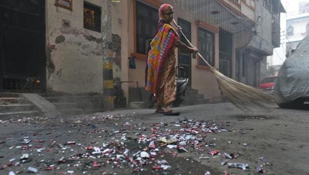 A worker cleaning the remains of crackers scattered in the morning after the Diwali celebrations. (HT FILE PHOTO) A worker cleaning the remains of crackers scattered in the morning after the Diwali celebrations. (HT FILE PHOTO)
