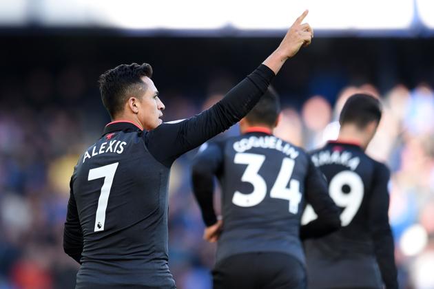 Arsenal striker Alexis Sanchez celebrates scoring their fifth goal during the English Premier League match between Everton and Arsenal at Goodison Park.(AFP)