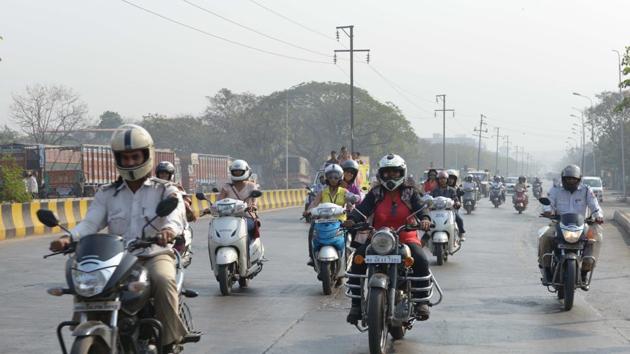 Under the West Bengal Motor Vehicles Act, one person driving a two-wheeler without a standard helmet will attract a minimum fine of Rs 100. (HT File Photo) Under the West Bengal Motor Vehicles Act, one person driving a two-wheeler without a standard helmet will attract a minimum fine of Rs 100. (HT File Photo)