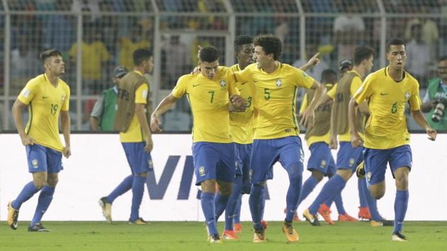 Brazil players celebrate after defeating Germany in a FIFA U-17 World Cup quarter-final in Kolkata on Sunday. (AP) Brazil players celebrate after defeating Germany in a FIFA U-17 World Cup quarter-final in Kolkata on Sunday. (AP)