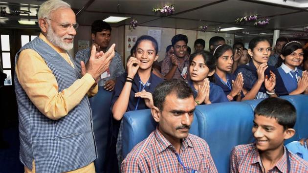 Prime Minister Narendra Modi interacts with the children during his maiden voyage on the Ghogha-Dahej Ro-Ro ferry service in Bhavnagar, Gujarat on Sunday. (PTI) Prime Minister Narendra Modi interacts with the children during his maiden voyage on the Ghogha-Dahej Ro-Ro ferry service in Bhavnagar, Gujarat on Sunday. (PTI)