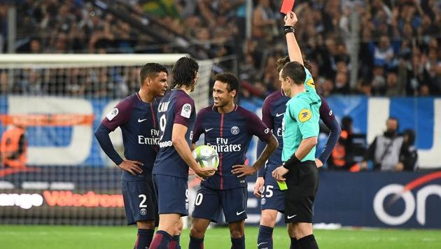French referee Ruddy Buquet shows a red card to Paris Saint-Germain's Brazilian forward Neymar (C) during the French L1 football match between Olympique Marseille and PSG on October 22, 2017, at the Velodrome Stadium in Marseille. (AFP) French referee Ruddy Buquet shows a red card to Paris Saint-Germain's Brazilian forward Neymar (C) during the French L1 football match between Olympique Marseille and PSG on October 22, 2017, at the Velodrome Stadium in Marseille. (AFP)