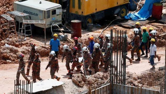 Three of the 14 workers buried by the landslide survived. The other victims were from China, Pakistan, Indonesia, Myanmar and Bangladesh. (Twitter Photo) Three of the 14 workers buried by the landslide survived. The other victims were from China, Pakistan, Indonesia, Myanmar and Bangladesh. (Twitter Photo)