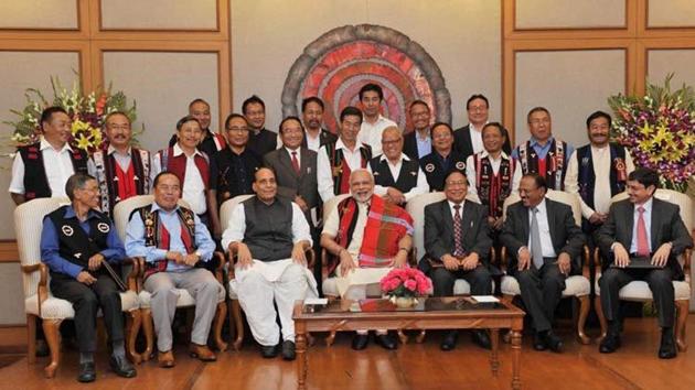 A file picture shows Prime Minister Narendra Modi and Union home minister Rajnath Singh with Naga leaders after signing the framework agreement in 2015. Seated on the extreme right is R N Ravi, chief interlocutor and Prime Minister Narendra Modi’s envoy, who is leading the Centre’s team of interlocutors.(PTI FILE PHOTO)