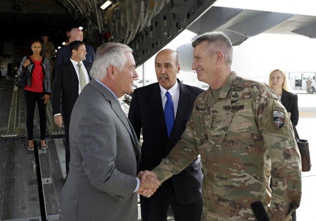 US secretary of state Rex Tillerson is greeted is greeted by Gen John Nicholson (R) as special charge d'affaires Hugo Llorens (C) looks on upon arriving at Bagram Air Base in Afghanistan on Monday. (AFP) US secretary of state Rex Tillerson is greeted is greeted by Gen John Nicholson (R) as special charge d'affaires Hugo Llorens (C) looks on upon arriving at Bagram Air Base in Afghanistan on Monday. (AFP)
