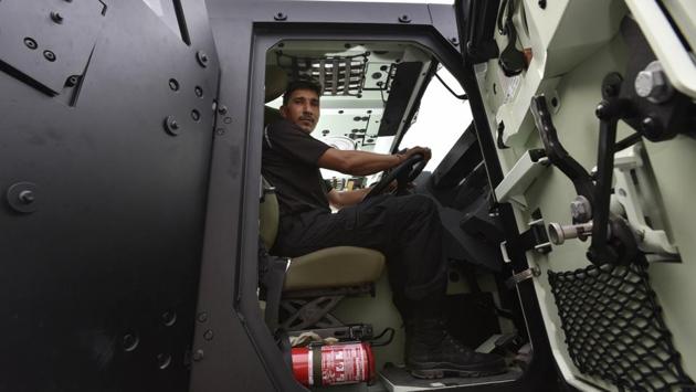 A CISF officer shows the interiors of the bulletproof heavy vehicle, Renault Sherpa, which can accommodate four armed personnel who can fire from inside to neutralise any suspect. (Vipin Kumar / HT Photo)