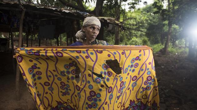 Bayaji Dadu Bendre, 45, from Chafacha pada in Aarey, faced her worst fears when she was attacked by a leopard on Dussehra, while out to relieve herself in a farm near her home. Lacking basic facilities such as electricity and toilets, the inhabitants of these villages, mostly members of the Warli tribe, don’t step outside, making do with buckets and lanterns as the predators’ shadows loom close outside. (Satish Bate / HT Photo)