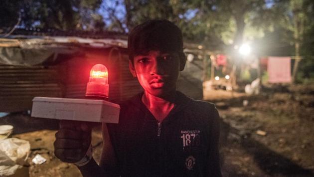 The forest department has installed emergency blinking lights at the corners of hamlets to ward off leopards. Nathu Rathod, CEO Aarey promises that electricity will come to the hamlets by March 2018 eliminating this need. Bhoir, counters that only a few houses have these lights, a sign ‘...that authorities want us to shift to slum rehabilitation authority (SRA) buildings and free these areas for more infrastructure development’. (Satish Bate / HT Photo)