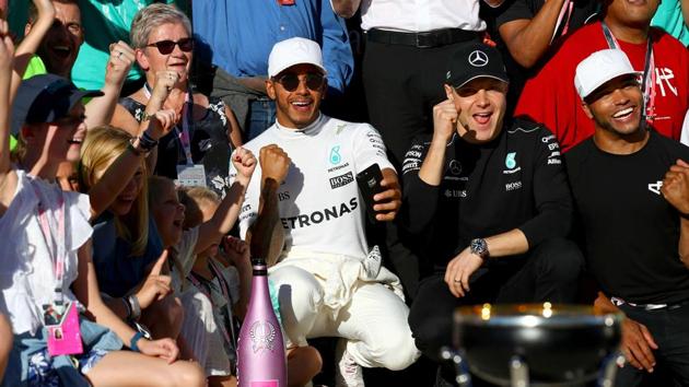 Lewis Hamilton celebrates with his team after the United States Grand Prix win. (AFP) Lewis Hamilton celebrates with his team after the United States Grand Prix win. (AFP)