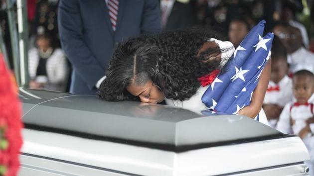 File photo taken on October 21, 2017 shows Myeshia Johnson as she kisses the casket of her husband, Sgt La David Johnson, during his burial service at the Memorial Gardens East cemetery in Hollywood, Florida. President Donald Trump struggled to remember the name of the soldier killed in an ambush in Niger when he called Myeshia Johnson for condolences, the woman told ABC. (AFP) File photo taken on October 21, 2017 shows Myeshia Johnson as she kisses the casket of her husband, Sgt La David Johnson, during his burial service at the Memorial Gardens East cemetery in Hollywood, Florida. President Donald Trump struggled to remember the name of the soldier killed in an ambush in Niger when he called Myeshia Johnson for condolences, the woman told ABC. (AFP)