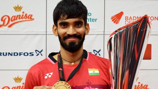Kidambi Srikanth poses with trophy after winning the Denmark Open Super Series Badminton Championship in Odense on Sunday.(PTI)