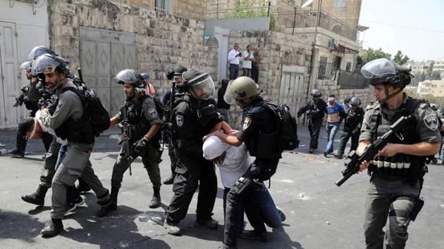 Israeli security forces arrest Palestinian men following clashes outside Jerusalem's Old city. (REUTERS File Photo) Israeli security forces arrest Palestinian men following clashes outside Jerusalem's Old city. (REUTERS File Photo)