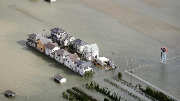 Houses are seen flooded in Kinokawa, western Japan on October 23, 2017 after rain brought by Typhoon Lan. Some 80,000 people in Koriyama, a city 200 km north of Tokyo were ordered to evacuate as a river neared the top of its banks, NHK said, with several hundred houses in western Japan flooded. (Yuki Sato / Kyodo News via AP) Houses are seen flooded in Kinokawa, western Japan on October 23, 2017 after rain brought by Typhoon Lan. Some 80,000 people in Koriyama, a city 200 km north of Tokyo were ordered to evacuate as a river neared the top of its banks, NHK said, with several hundred houses in western Japan flooded. (Yuki Sato / Kyodo News via AP)