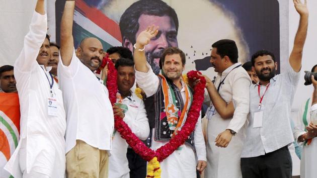 Supporters garland Congress vice president Rahul Gandhi at a public meeting at Devghad Bariya village of Dahod district. (PTI FILE) Supporters garland Congress vice president Rahul Gandhi at a public meeting at Devghad Bariya village of Dahod district. (PTI FILE)