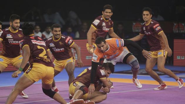 Sandeep Narwal of Puneri Paltan is pinned down by UP Yoddha players during their Vivo Pro Kabaddi league match in Mumbai on October 23. (AP) Sandeep Narwal of Puneri Paltan is pinned down by UP Yoddha players during their Vivo Pro Kabaddi league match in Mumbai on October 23. (AP)