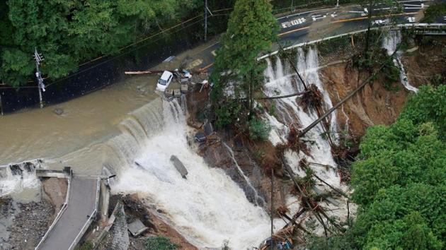 A collapsed road is seen following torrential rain caused by typhoon Lan in Kishiwada, Japan, on Monday. (Reuters) A collapsed road is seen following torrential rain caused by typhoon Lan in Kishiwada, Japan, on Monday. (Reuters)