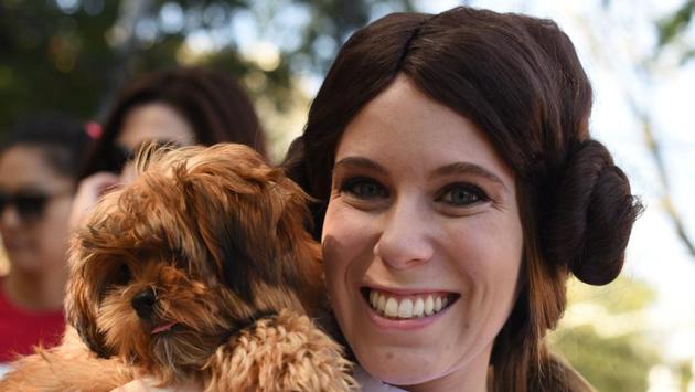 A participant dressed as Princess Leia poses with ‘chewbarka’ during the 27th Annual Tompkins Square Halloween Dog Parade in Manhattan. (Timothy A. Clary / AFP)