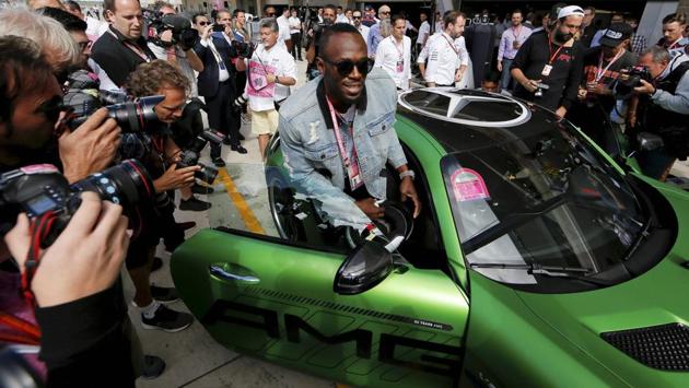 Austin: Sprinter Usain Bolt gets into a car to ride a lap with driver Lewis Hamilton. (AP) Austin: Sprinter Usain Bolt gets into a car to ride a lap with driver Lewis Hamilton. (AP)