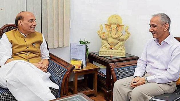 Union home minister Rajnath Singh with former director of the Intelligence Bureau and current Kashmir interlocutor, Dineshwar Sharma, in New Delhi on Monday.(PTI Photo)