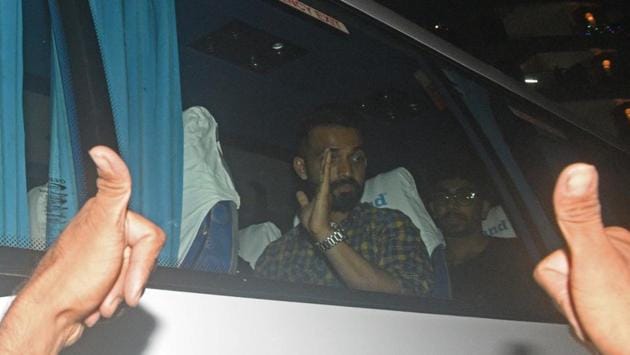 Indian cricket players Ajunkya Rahane (L) and Jaspreet Bumrah (R) acknowledging the cheer of fans outside Kedar Jadhav's house in Kothrud in Pune. (Pratham Gokhale/HT Photo) 