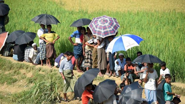 Rohingya refugees wait for relief aid at Balukhali refugee camp in the Bangladeshi district of Ukhia. (AFP Photo) Rohingya refugees wait for relief aid at Balukhali refugee camp in the Bangladeshi district of Ukhia. (AFP Photo)