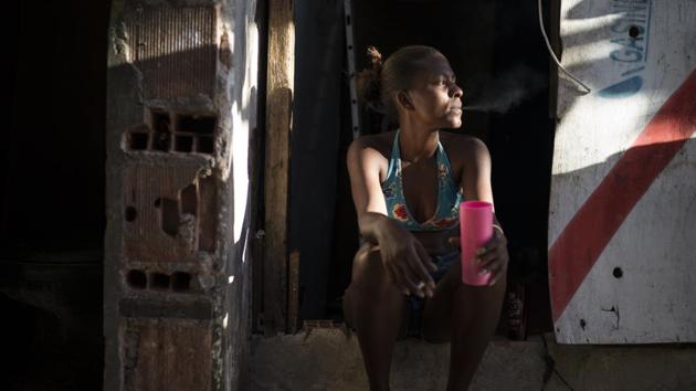 When Leticia Miranda had a job selling newspapers on the streets, she earned about $160 a month, just enough to pay for a tiny apartment she shared with her 8-year-old son. After losing her job about six months ago, she had no choice but to move the abandoned building where several hundreds were already living. Now, even as job losses have been pushing more people to programs like Bolsa Familia, fewer are being covered. (Felipe Dana / AP)