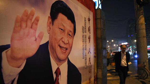 A man walks past a roadside poster of Chinese President Xi Jinping after the closing of the 19th Communist Party Congress in Beijing on October 24, 2017. (AFP Photo) A man walks past a roadside poster of Chinese President Xi Jinping after the closing of the 19th Communist Party Congress in Beijing on October 24, 2017. (AFP Photo)