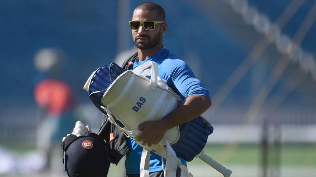 Indian cricketer Shikhar Dhawan walks back after batting in the nets. (AFP) 