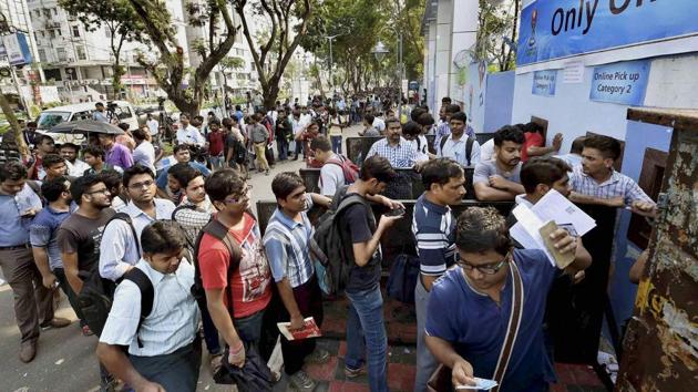 Football lovers standing in a long queue to buy the ticket for the match between Brazil and England. (PTI)