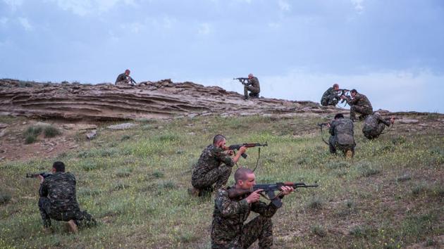 A file photo shows foreign fighters who joined the Kurdish People's Protection Units to fight in their ranks against jihadists and Islamist rebels in northeastern Syria taking part in a training session in the south-west Syrian region of Ras al-Ain, close to the Turkish border. (AFP Photo) A file photo shows foreign fighters who joined the Kurdish People's Protection Units to fight in their ranks against jihadists and Islamist rebels in northeastern Syria taking part in a training session in the south-west Syrian region of Ras al-Ain, close to the Turkish border. (AFP Photo)