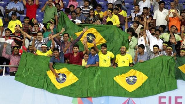 Fans cheer during the FIFA U-17 World Cup quarter-final match between Brazil and Germany at Kolkata’s Salt lake Stadium on October 22, 2017. Kolkata will host the Brazil vs England semis on Wednesday. (AP) Fans cheer during the FIFA U-17 World Cup quarter-final match between Brazil and Germany at Kolkata’s Salt lake Stadium on October 22, 2017. Kolkata will host the Brazil vs England semis on Wednesday. (AP)