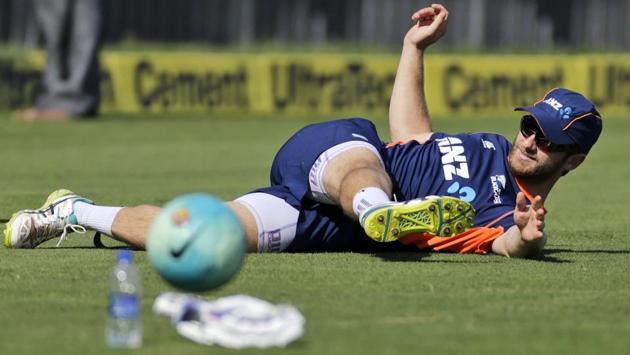 New Zealand's cricket captain Kane Williamson stretches during the practice session in Pune. (AP) 