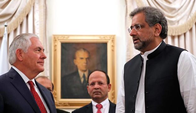 US secretary of state Rex Tillerson (left) is greeted by Pakistani Prime Minister Shahid Khaqan Abbasi (right) in Islamabad on October 24, 2017.(AFP)