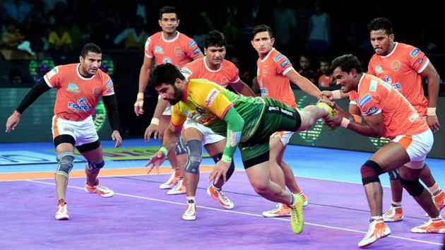 Pardeep Narwal in Green jersey of Patna Pirates is pin down by Puneri Paltan players during their Vivo Pro Kabaddi league match in Mumbai. (PTI) Pardeep Narwal in Green jersey of Patna Pirates is pin down by Puneri Paltan players during their Vivo Pro Kabaddi league match in Mumbai. (PTI)