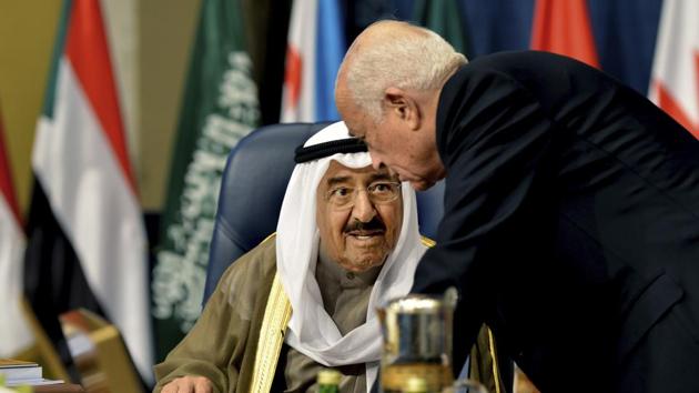 In this file photo, the Emir of Kuwait, Sheikh Sabah Al Ahmad Al Sabah, left, speaks with Secretary-General of the League of Arab States, Nabil El Araby, during the Arab League Summit in Bayan Palace, Kuwait City. Al Sabah said Tuesday that the crisis between a quartet of Arab countries and Qatar "could see more complications" even as he continues to try and mediate an end to the diplomatic standoff.(AP Photo)